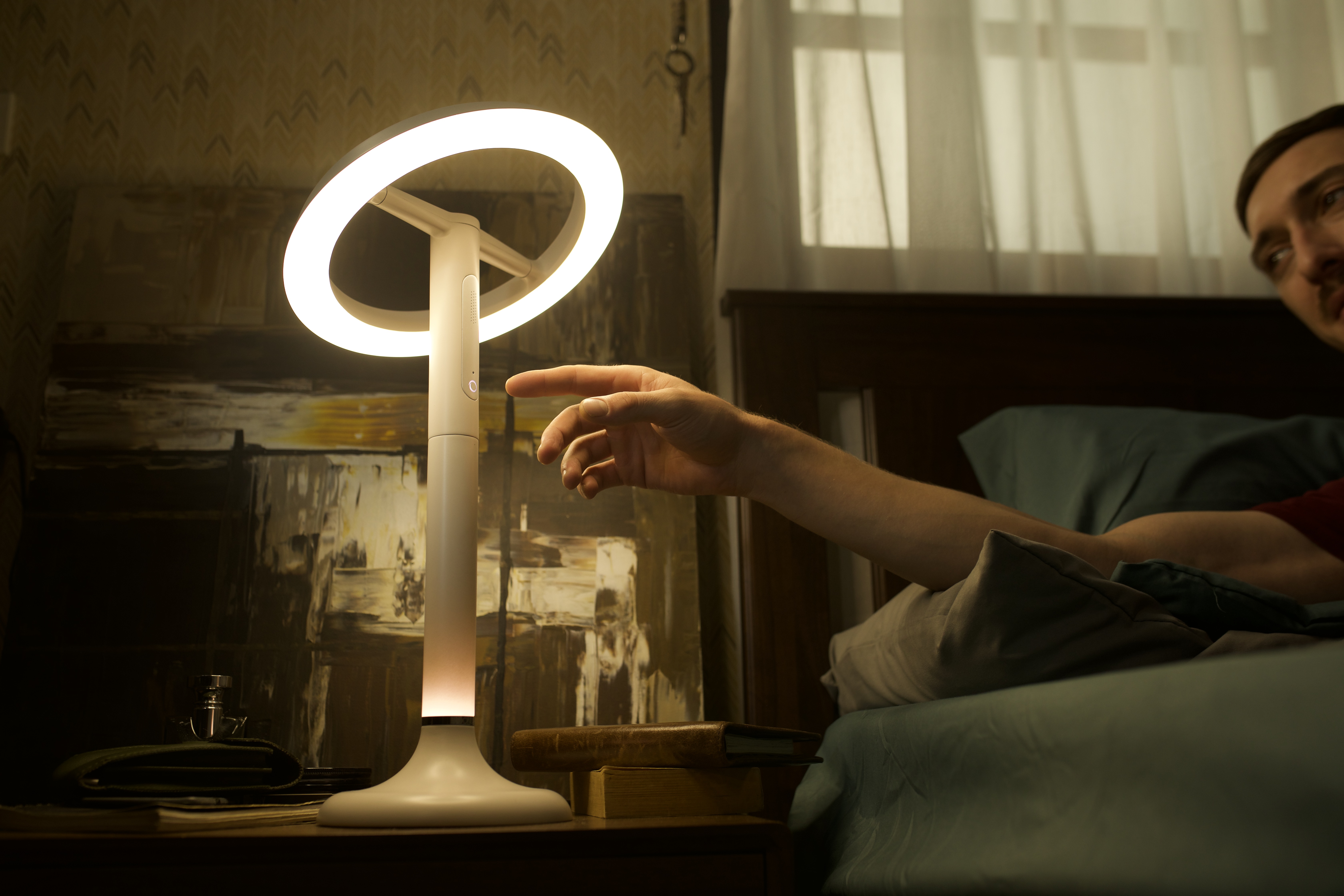 Person writing in bed beside Sunflower X